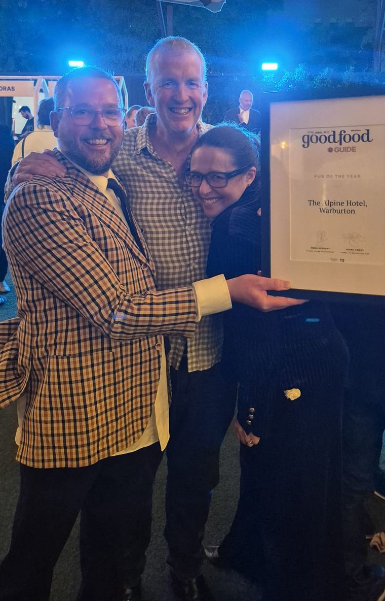 The Alpine Hotel team celebrating with The Age Good Food Guide Pub of the Year certificate