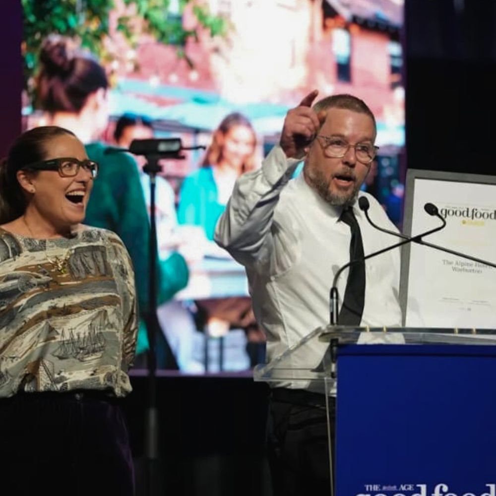 The Alpine Hotel accepting the Pub of the Year award on stage at The Age Good Food Guide 2027 awards