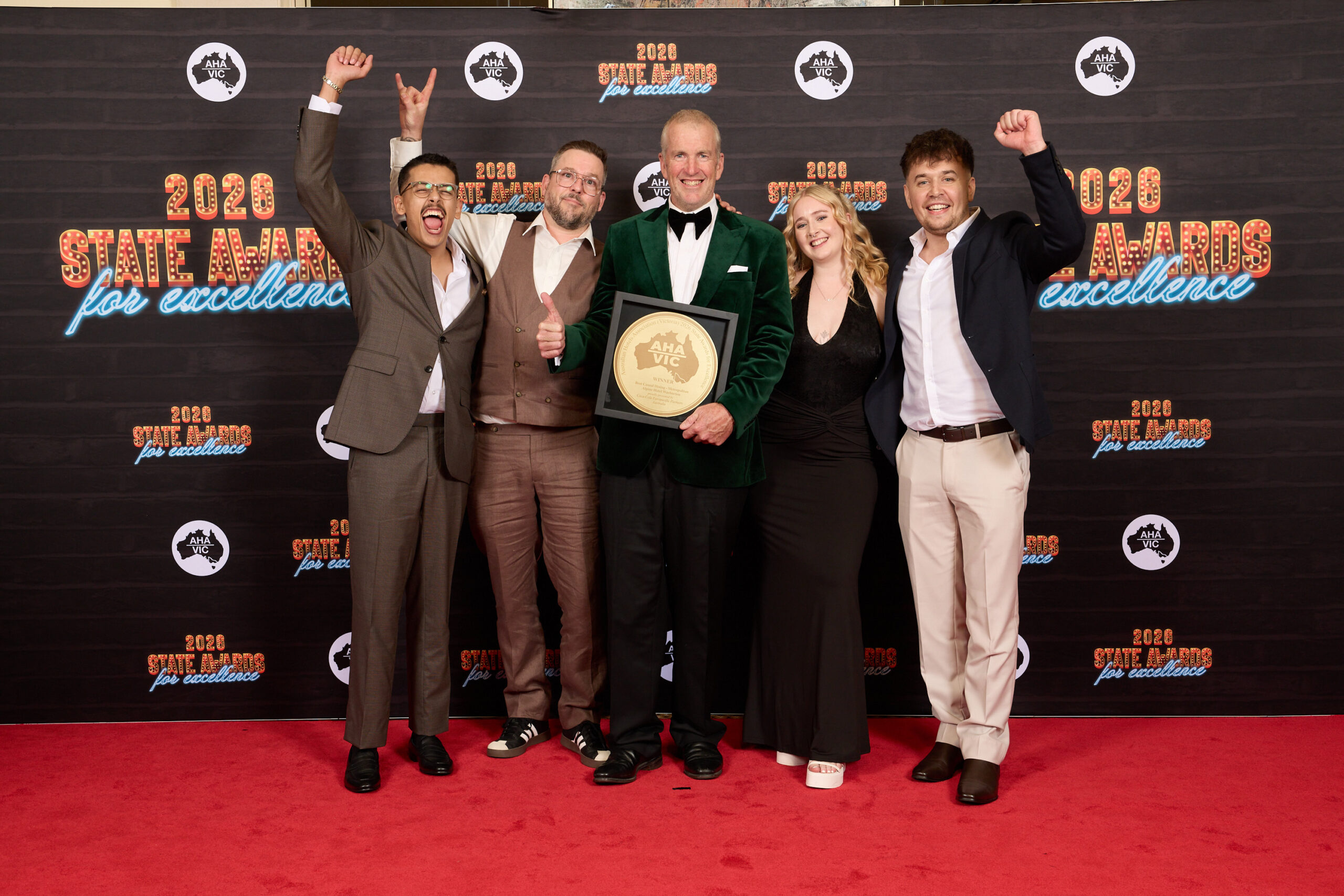 The Alpine Hotel team holding the Best Casual Dining – Metropolitan trophy at the 2026 AHA Victoria State Awards for Excellence